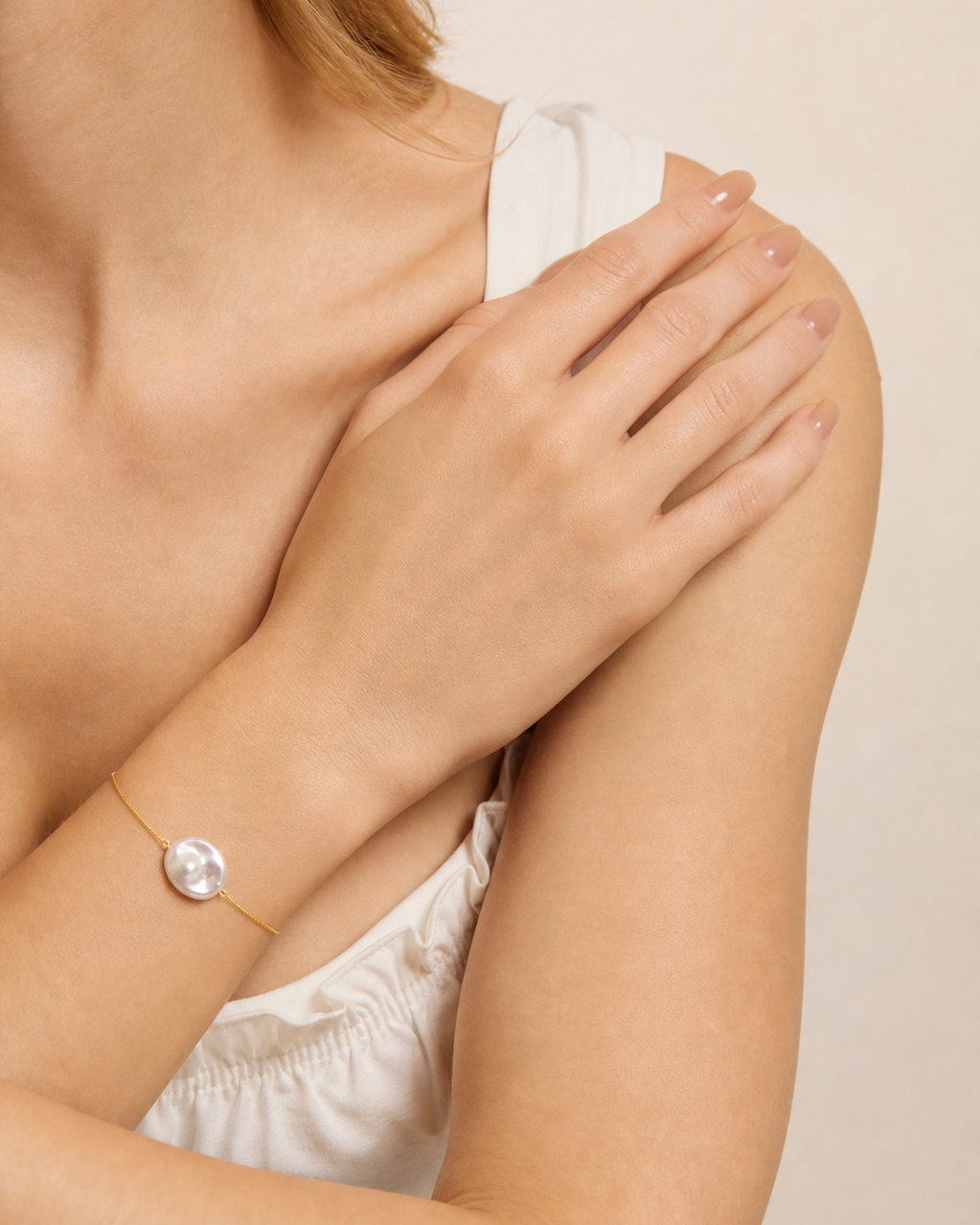 Serpentine Baroque Pearl Bracelet, styled with coordinating bracelets and rings on a model