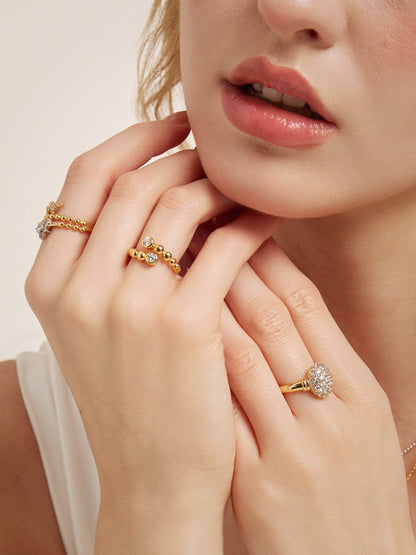 Bubble Stack Open Band Ring, worn by a model with the hand raised to highlight the setting